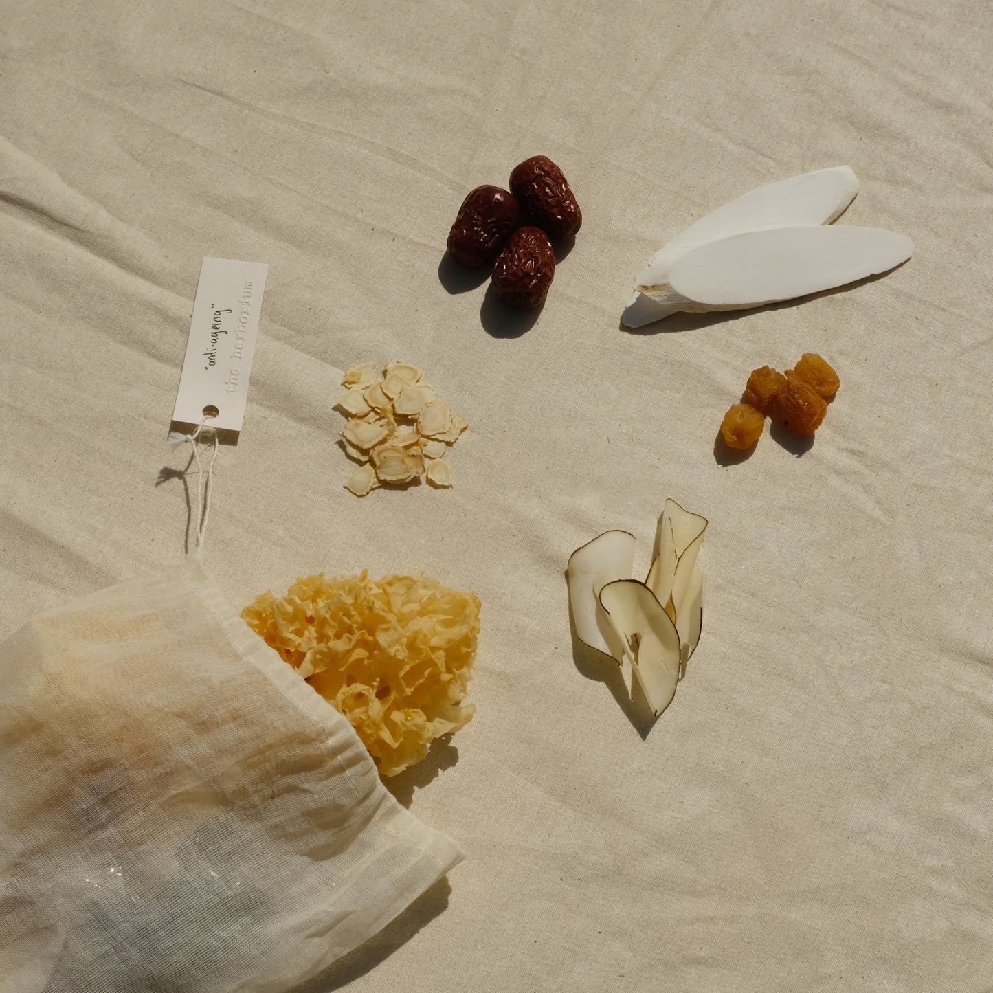 Cotton muslin bag with Chinese herbs snow fungus, American ginseng xi yang shen, red dates jujubes, coconut, longan, Chinese yam. Image 2